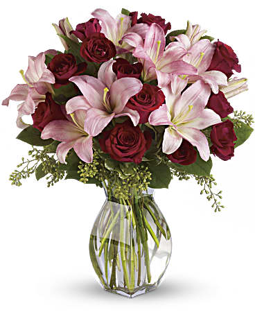 Lavish Love - Elegant bouquet of red roses and pink lilies in a vase, perfect for expressing affection.