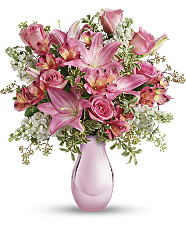 Beautiful pink bouquet in a pink vase, representing Pink Reflections, perfect for making someone's day.